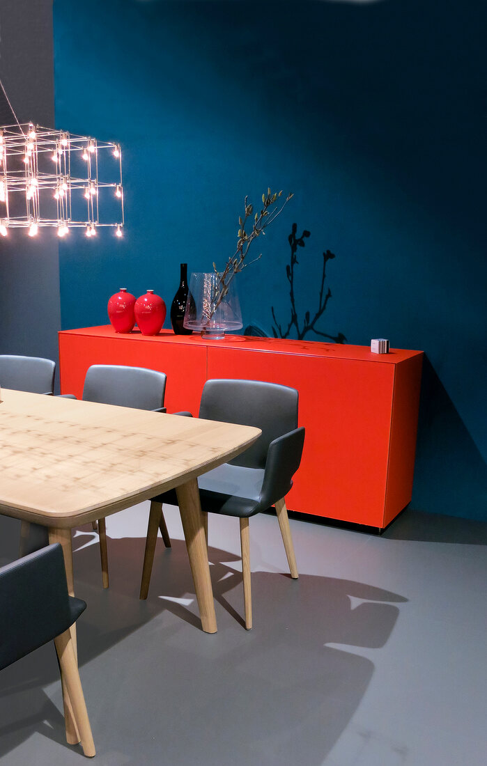 Dining room with dining table and red drawer chest