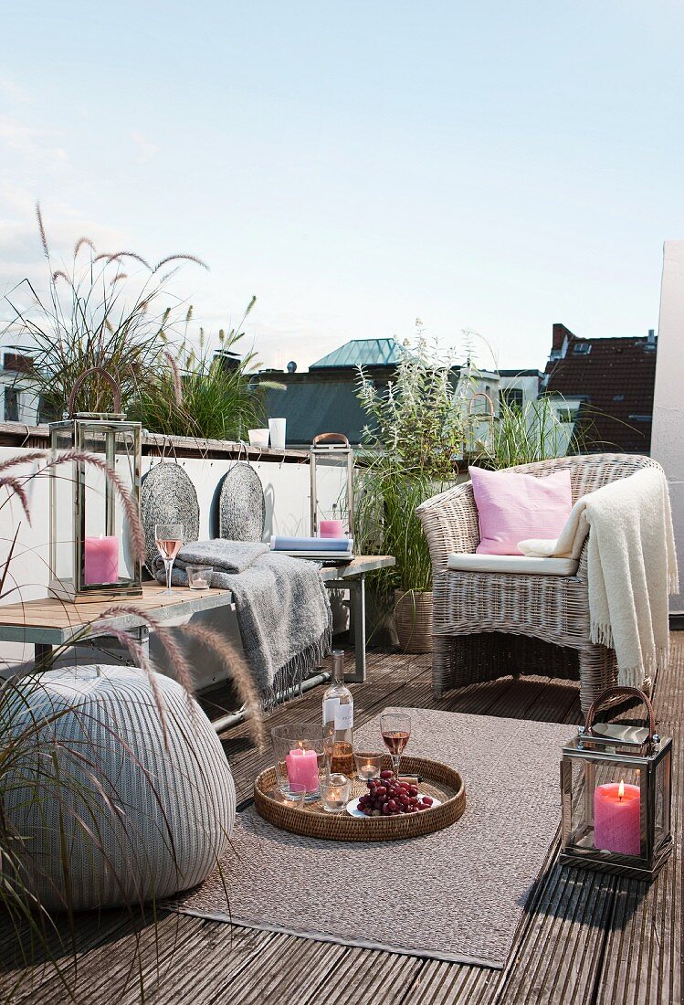 Comfortably furnished roof terrace with candle lantern