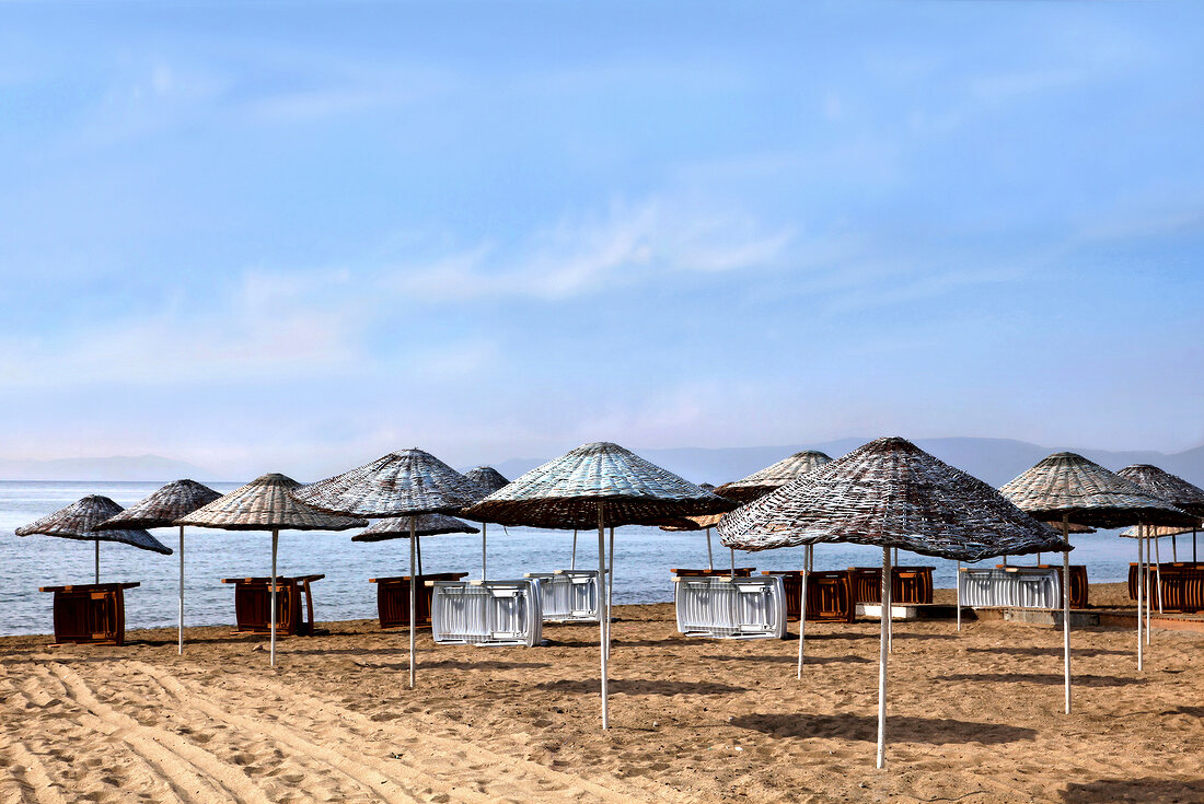 View of beach parasols on Badavut beach in Ayvalik, Aegean, Turkey