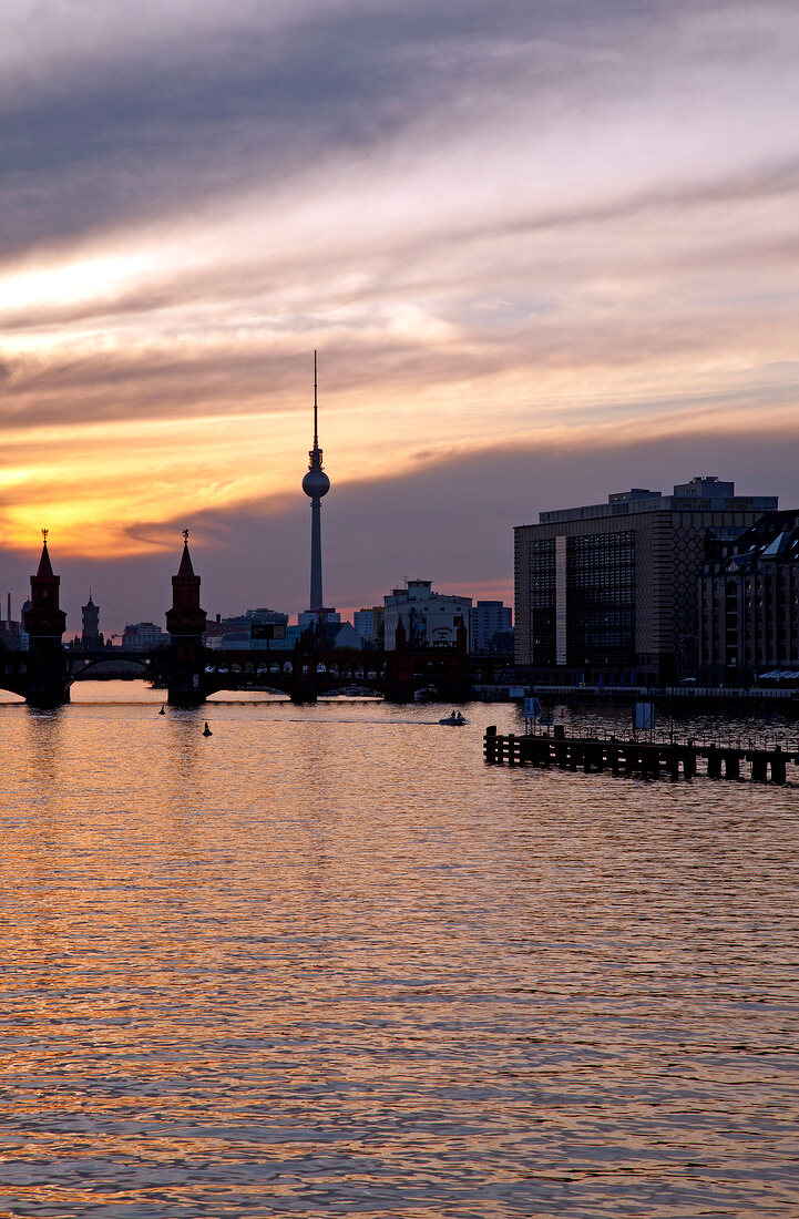 View of TV tower, upper tree bridge and River Spree at dusk in Berlin