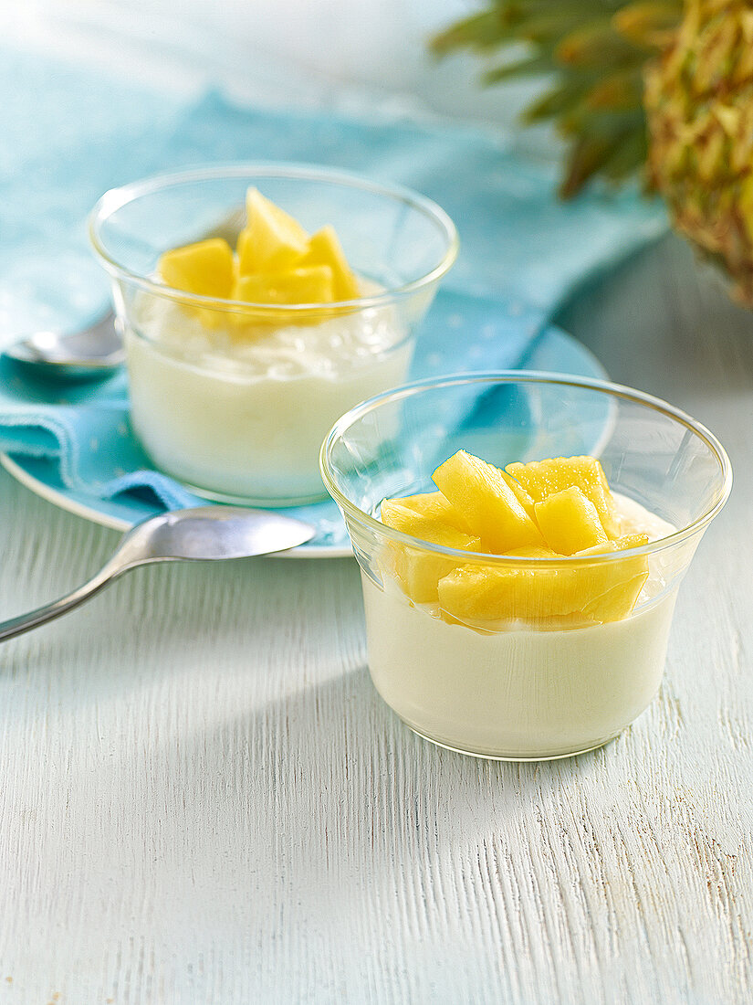 Two glasses of coconut cream with pineapple