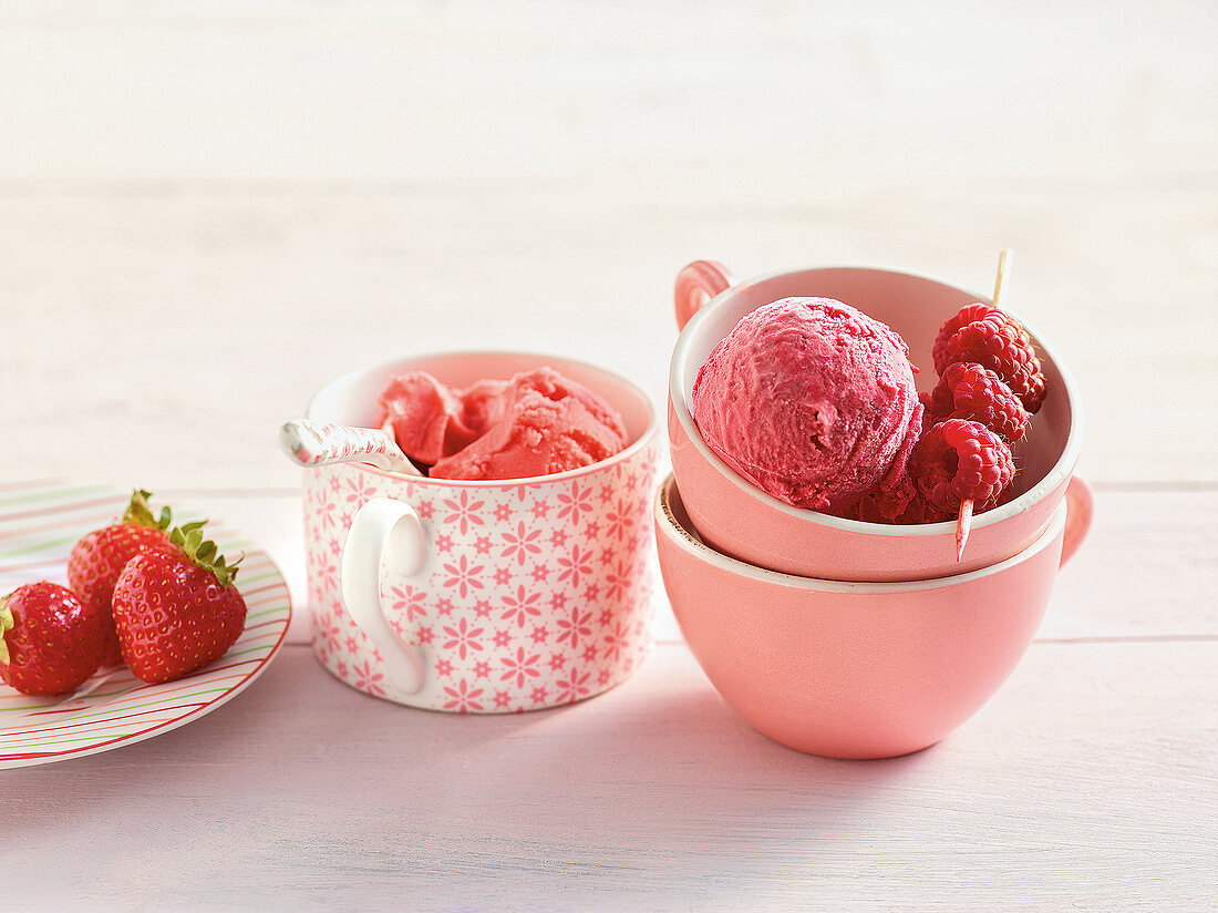 Strawberry and raspberry ice cream in cups