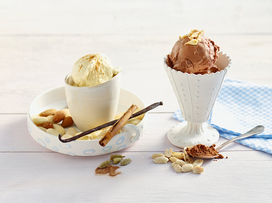 Two glasses with chocolate peanut ice cream and almond cinnamon ice cream