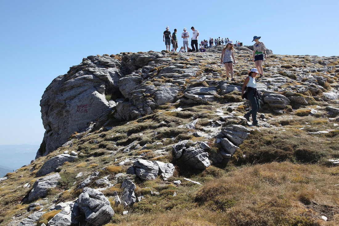 Tourists on Sarikiz Tepesi in Dilek Peninsula National Park, Kusadasi, Turkey