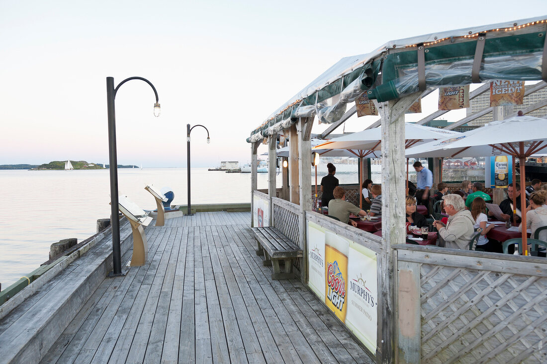 People having food near dockyard at Halifax Regional Municipality, Nova Scotia, Canada