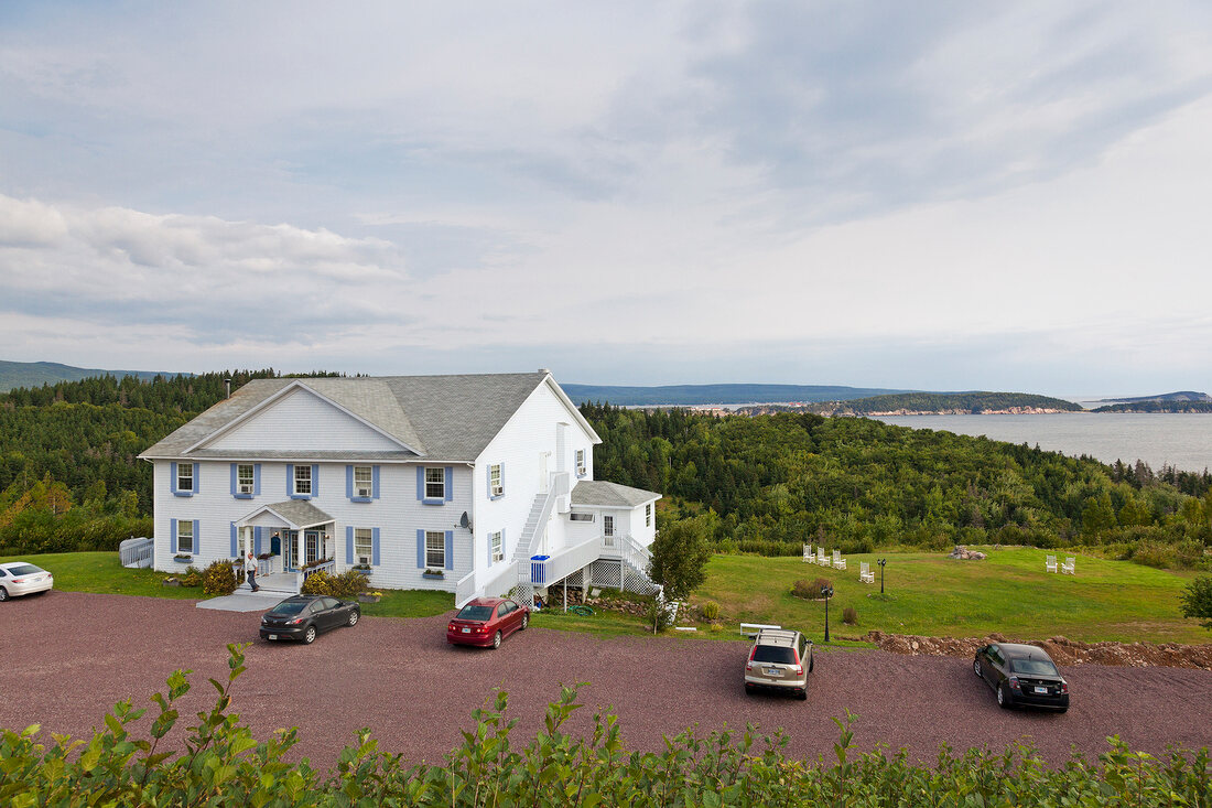 View of building and cars, Highlands National Park, Cape Breton Island, Canada