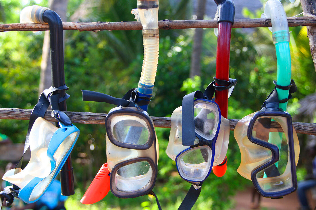 Various scuba masks hanging in Zanzibar, Tanzania, East Africa