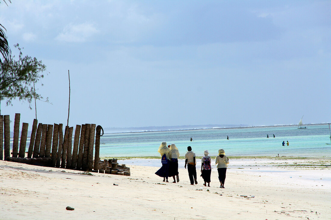 People walking on beach of Zanzibar, Tanzania, East Africa