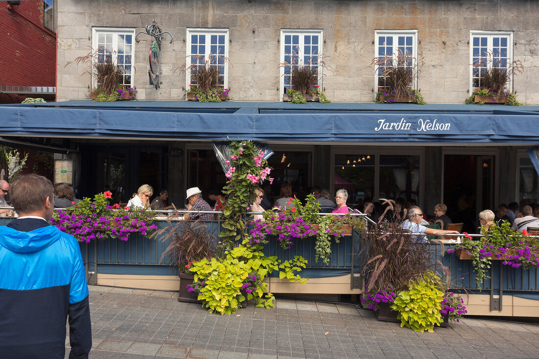 People sitting outside Restaurant Jardin Nelson on Place Jacques-Cartier, Montreal, Canada