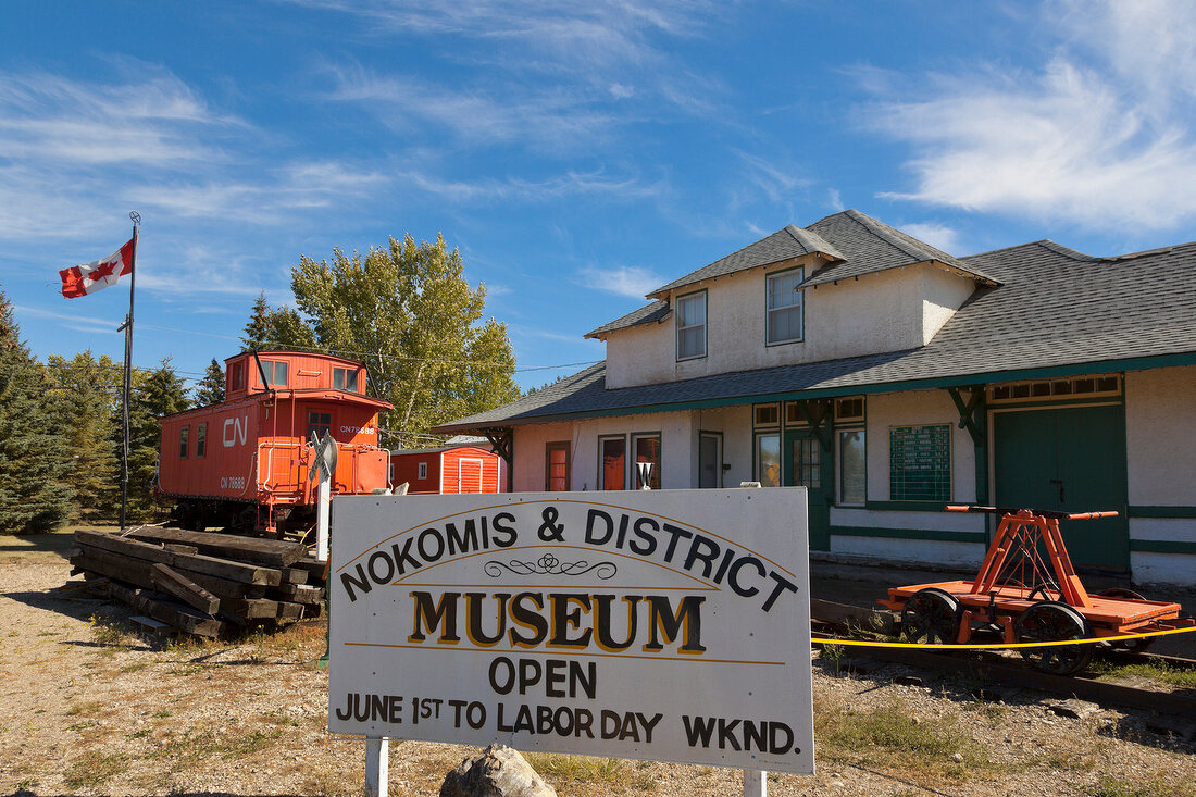 Signboard of Museum in Nokomis with old trains and house, Saskatchewan, Canada