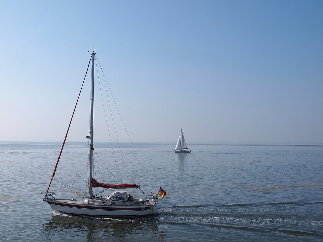 Sailboat in sea at Spiekeroog, Lower Saxony, Germany