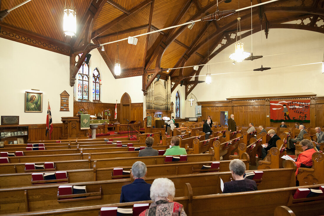 People praying at Zion Evangelical Lutheran Church, Nova Scotia, Canada