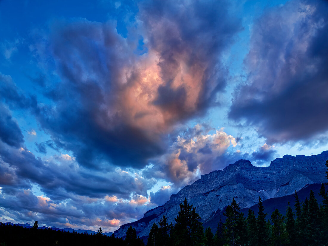 View of dramatic sky and Lake Minnewanka in Banff National Park, Alberta, Canada