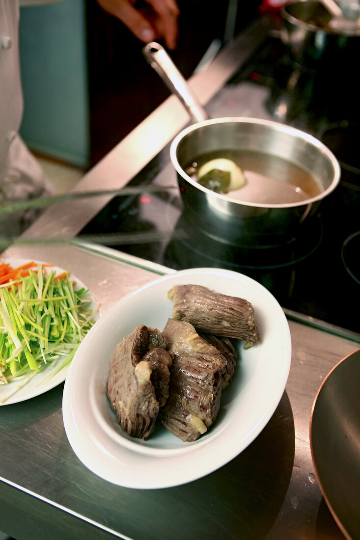 Boiled onglet steak on serving plate