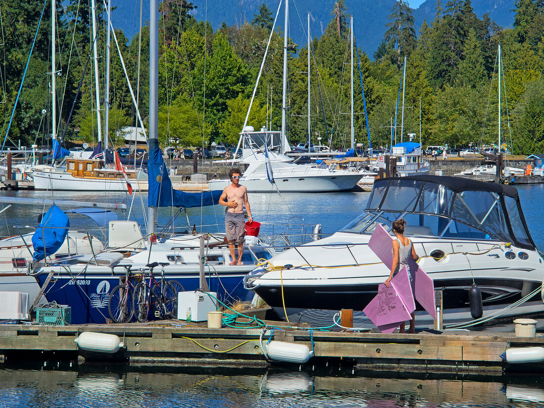 People at harbor of Bayshore West Marina in Vancouver, British Columbia, Canada