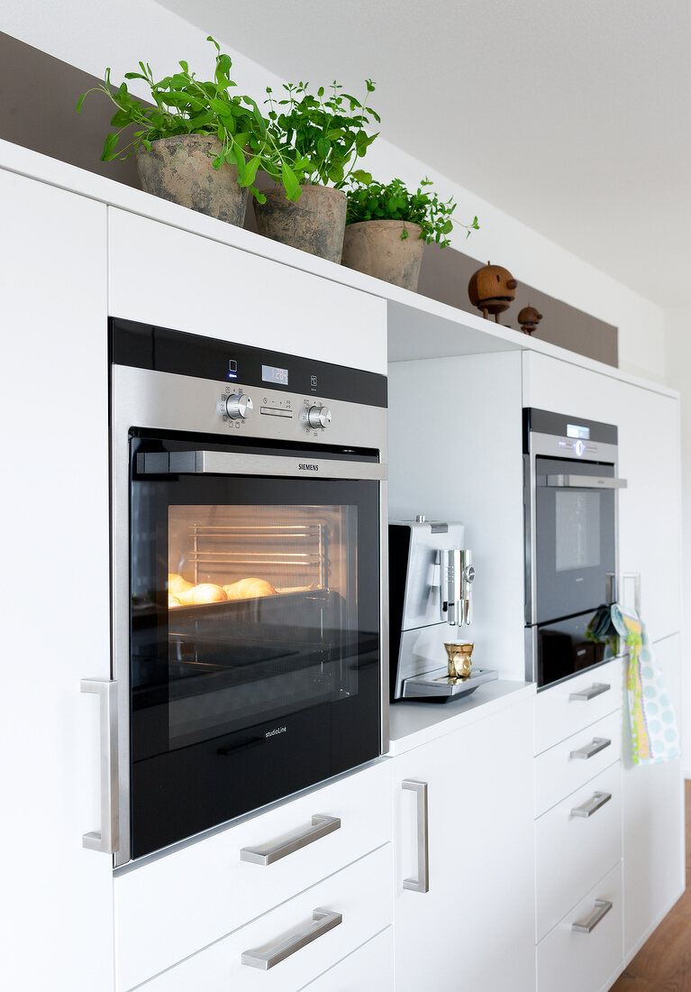 Steamer and coffee machine in kitchen