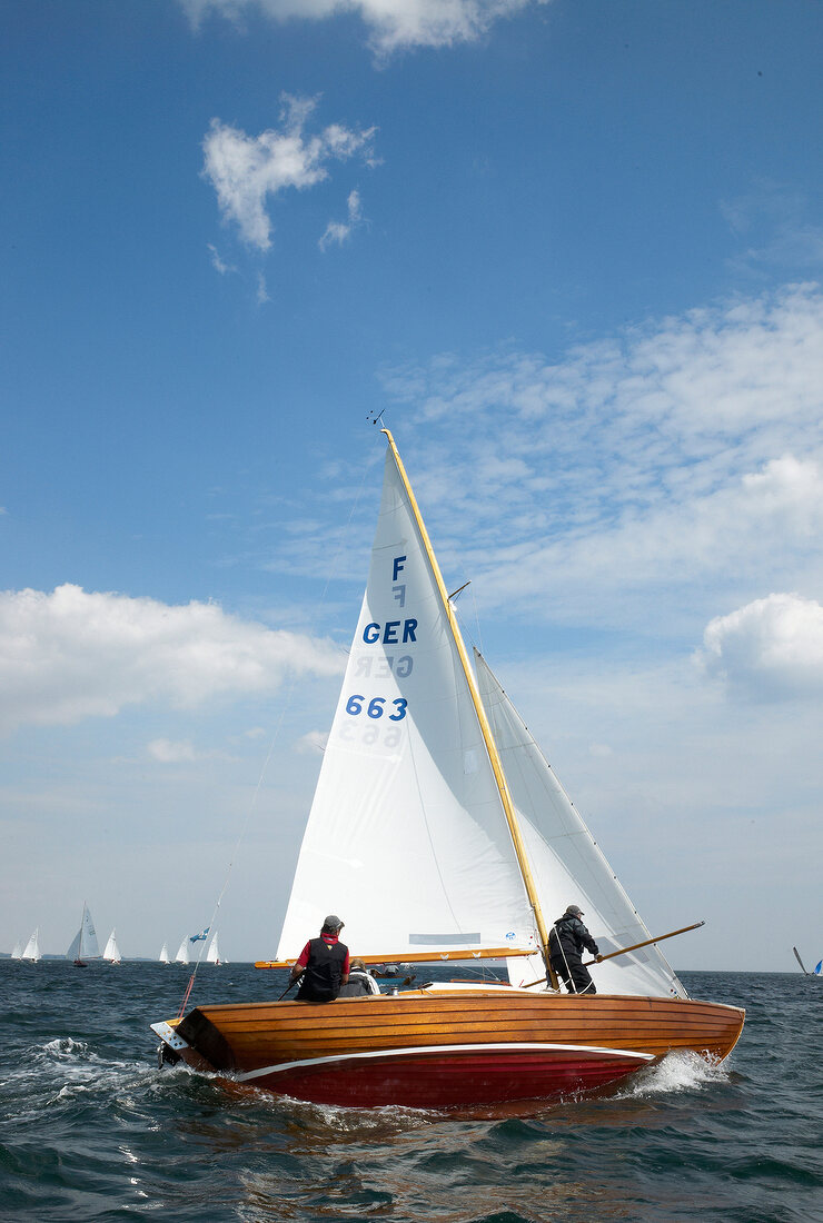 People in sail boat on Baltic Sea Coast, Germany
