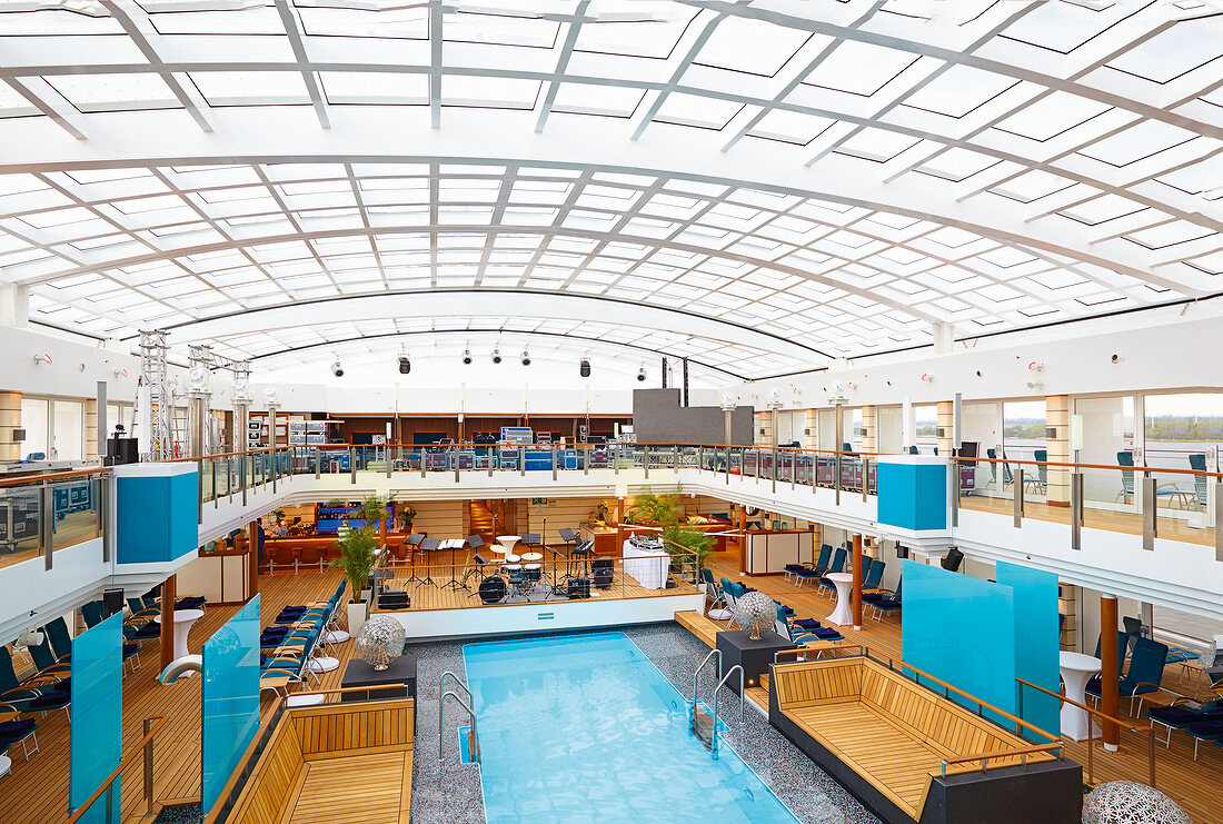 View of swimming pool and interior of cruise liner