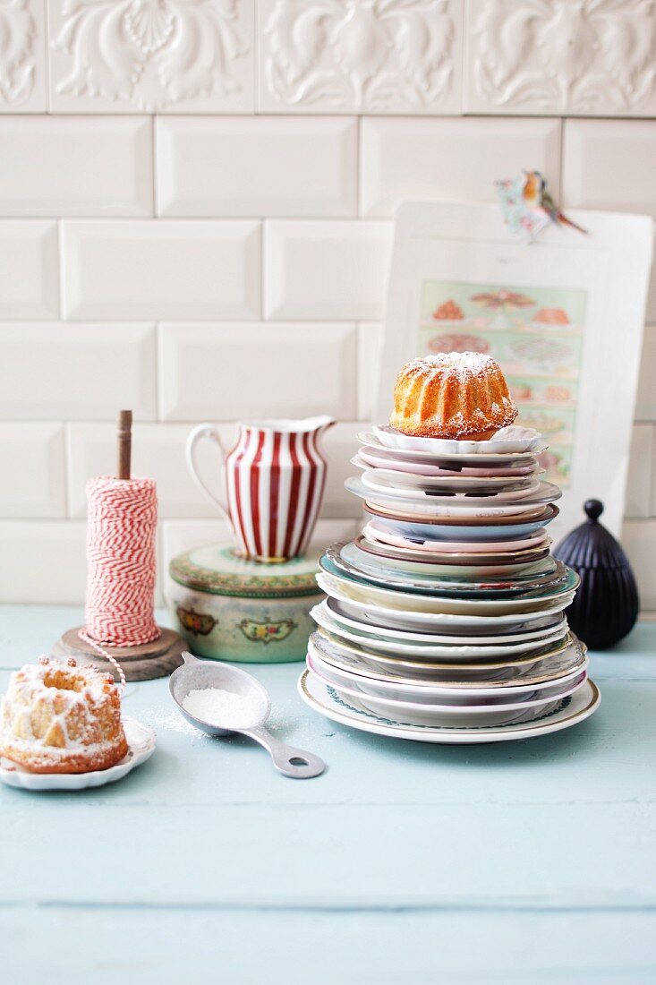 Mini Bundt cakes on a stack of plates and next to it