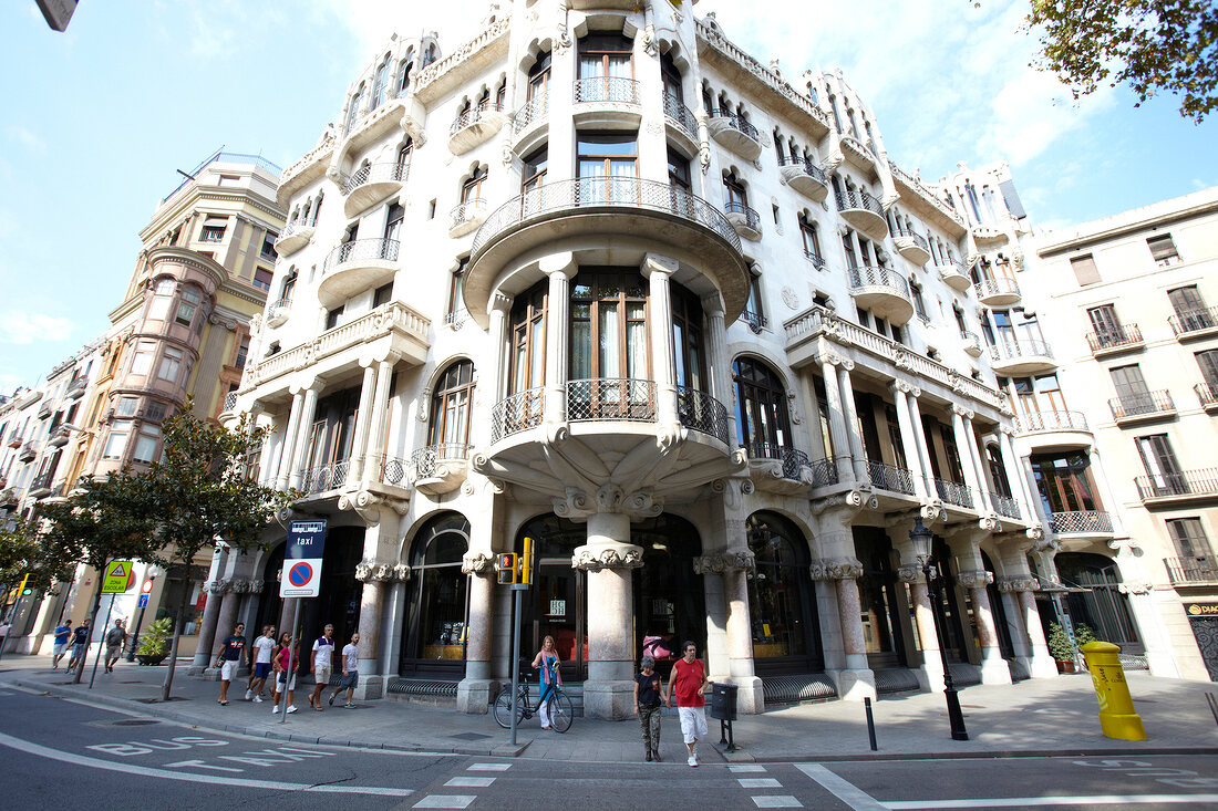 View of tourists on road near Hotel Casa Fuster at Barcelona, Spain
