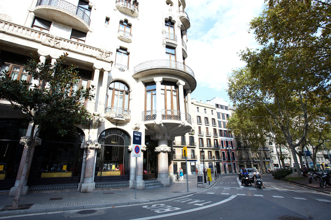 View of tourists on road near Hotel Casa Fuster at Barcelona, Spain
