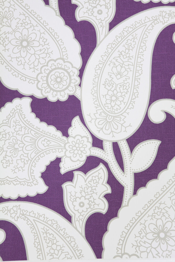 Close-up of floral patterned purple wallpaper with paisley design
