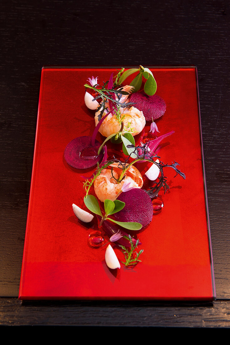 Lobster with beetroot and algal oil on plate