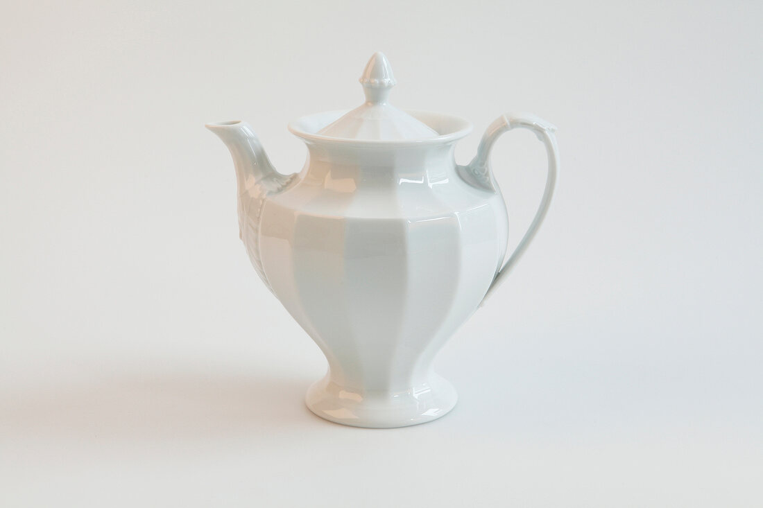 White porcelain jug on white background