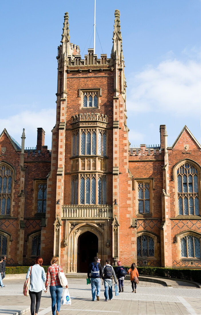 People walking at courtyard of Queen's University in Belfast, Northern Ireland