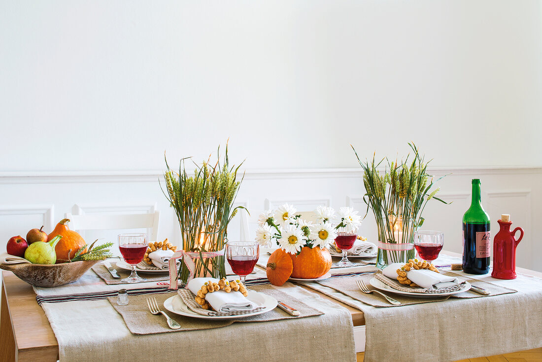 Beautifully decorated table with crockery and wine glasses