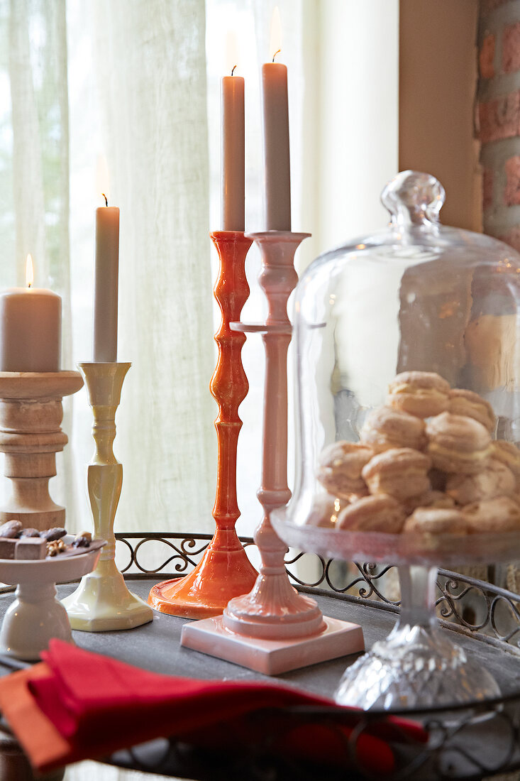 Candle holder and cake stand with cookies in it