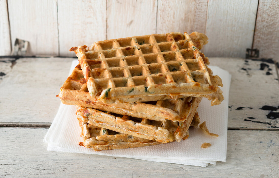 Stacked wild garlic waffles on tissue papers