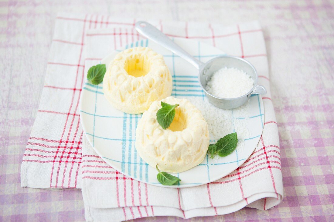 Mini mango parfait Bundt cakes with mint leaves and grated coconut