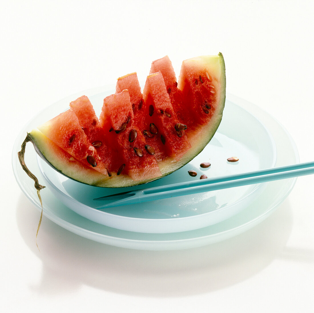 Slices of watermelon with rind on serving plate