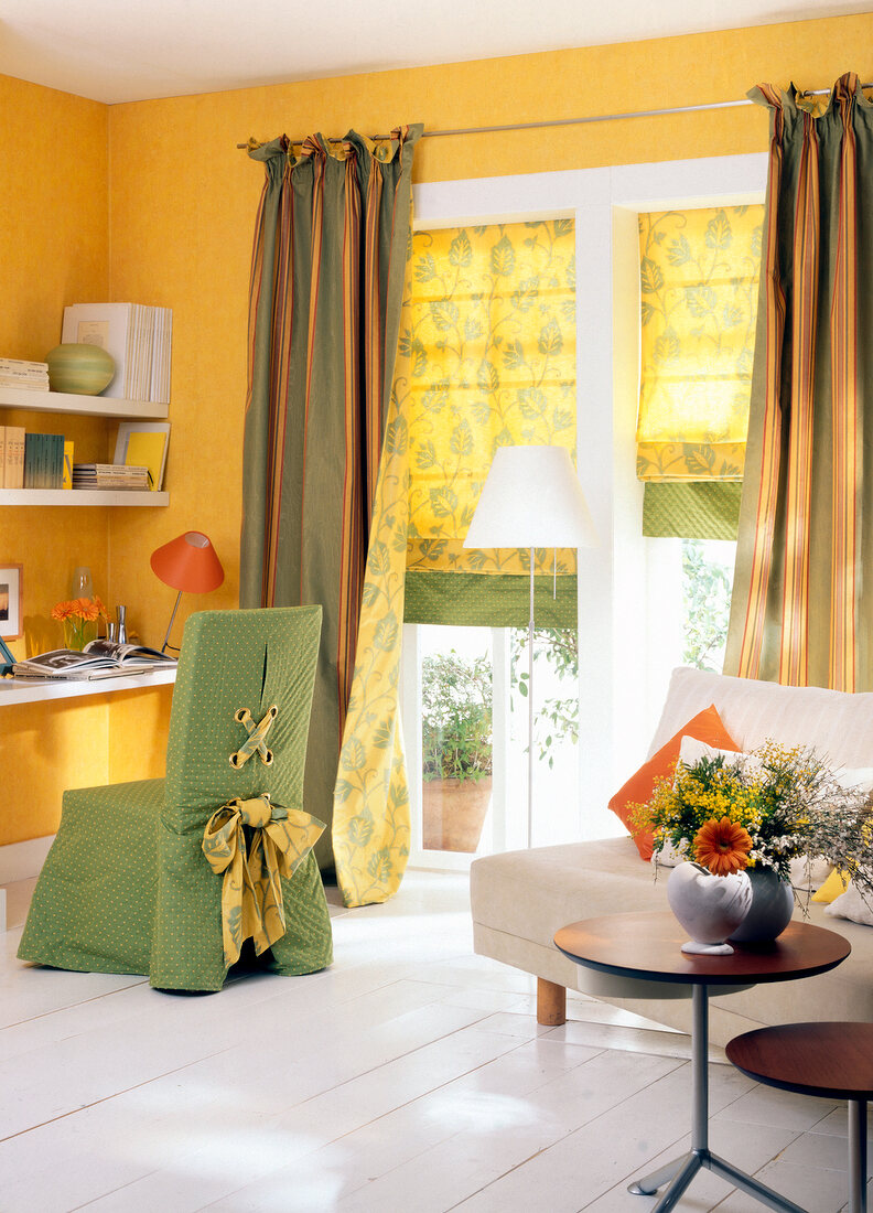 Room with curtains, armchair, sofa and table with vase