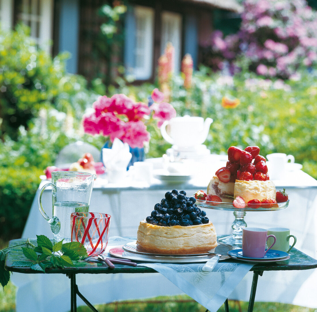 Blueberry and strawberry cheesecake on table