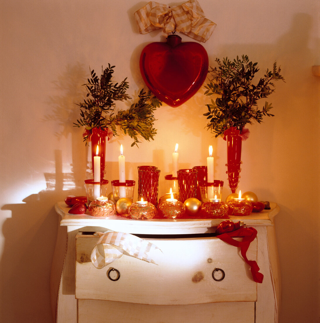 Drawer decorated with candles, red glass and red heart hang up