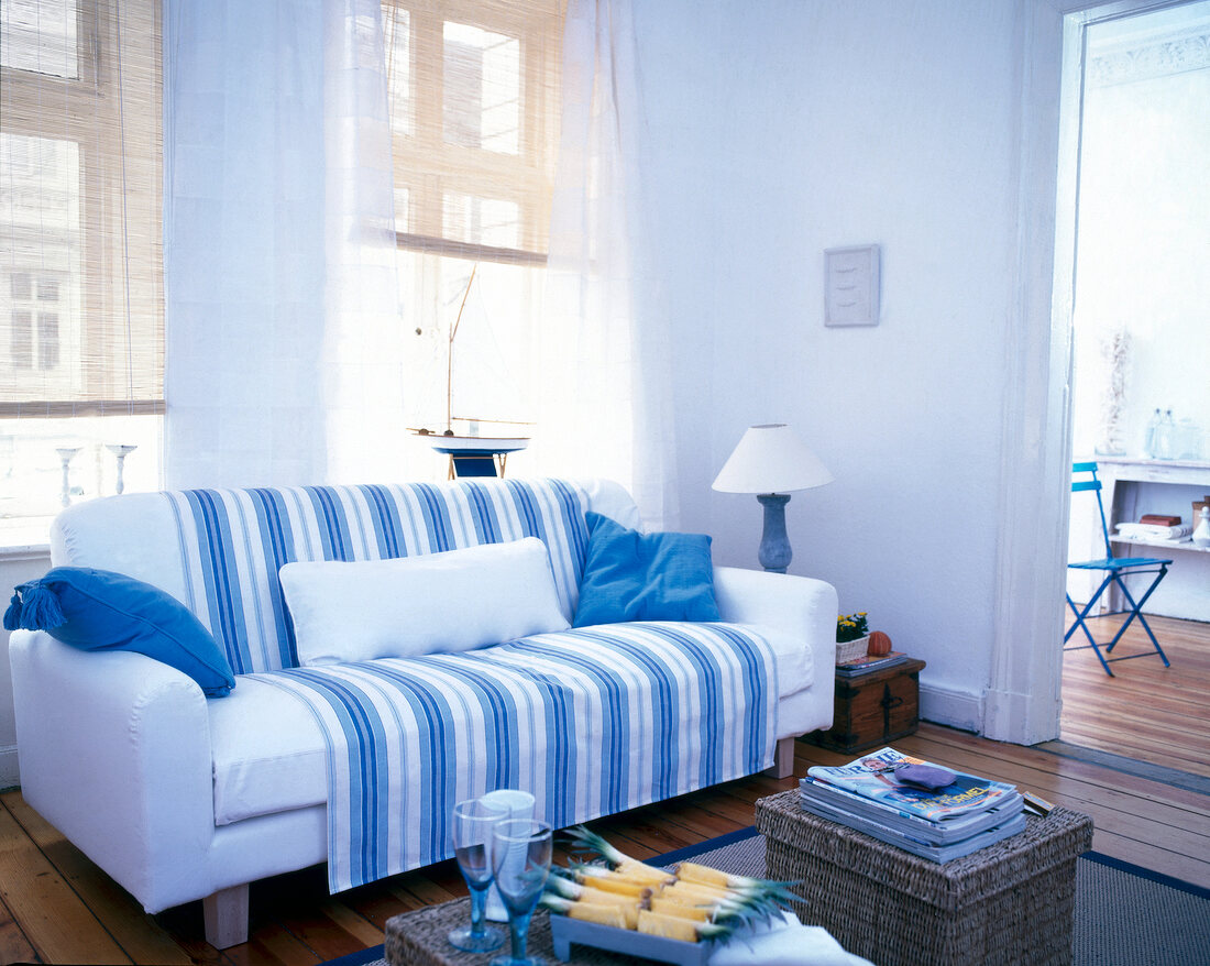 Striped fabric in blue and white adorns on sofa