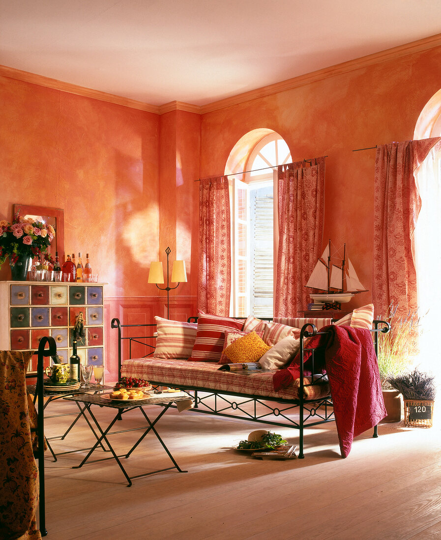 Living room in warm earth tones with sofa and cushions