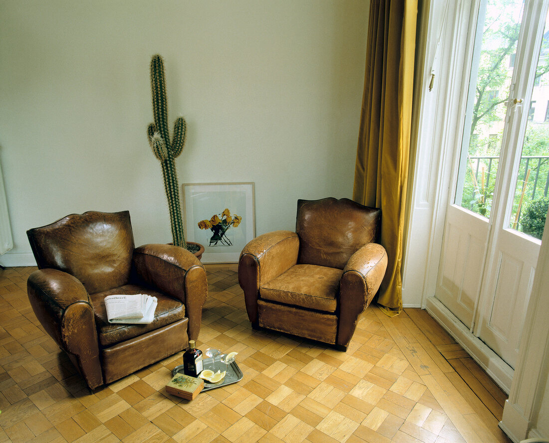 Two antique tobacco-coloured club chair