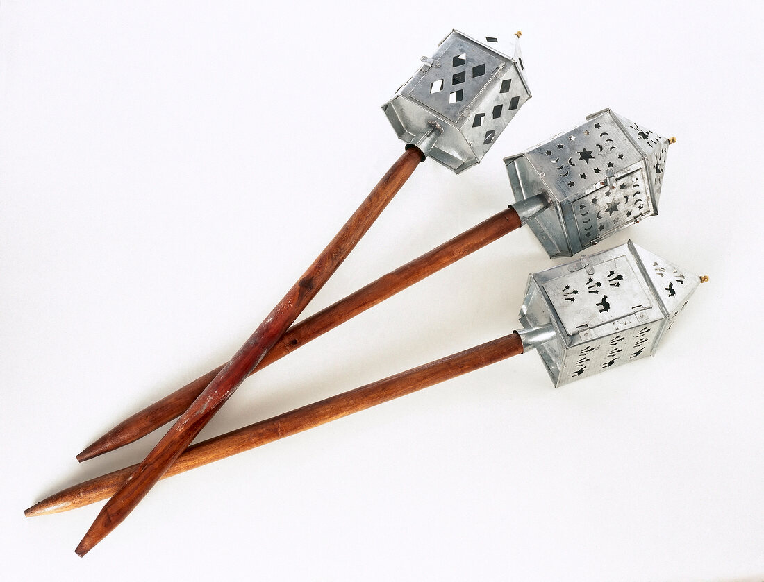 Lanterns with metal boxes on white background