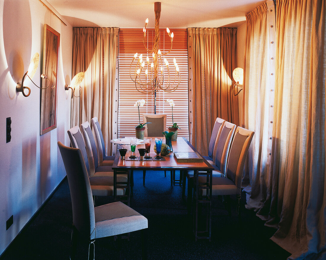 Dinning area with designer dining table and chandelier