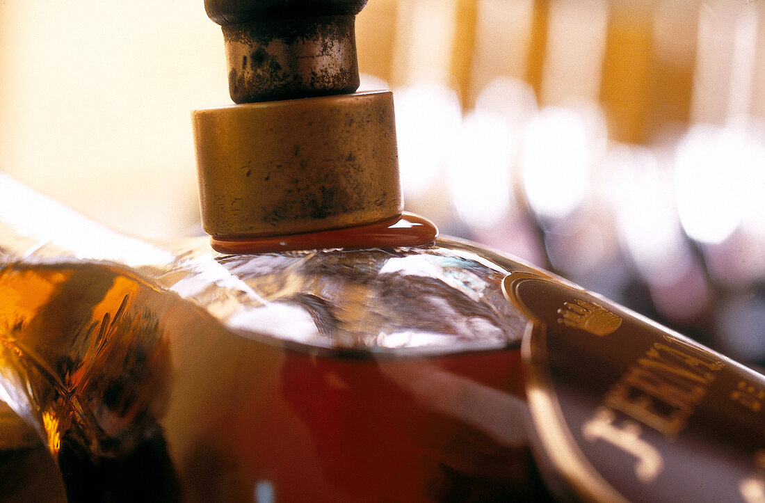 Close-up of brandy bottle being hand sealed, Bodega Fernando de Andrada