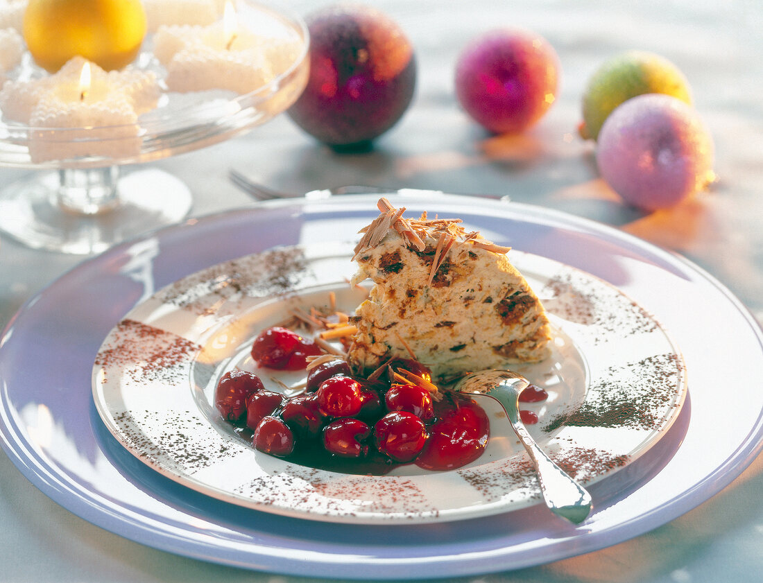 Gingerbread parfait with mulled wine cherries on round plate