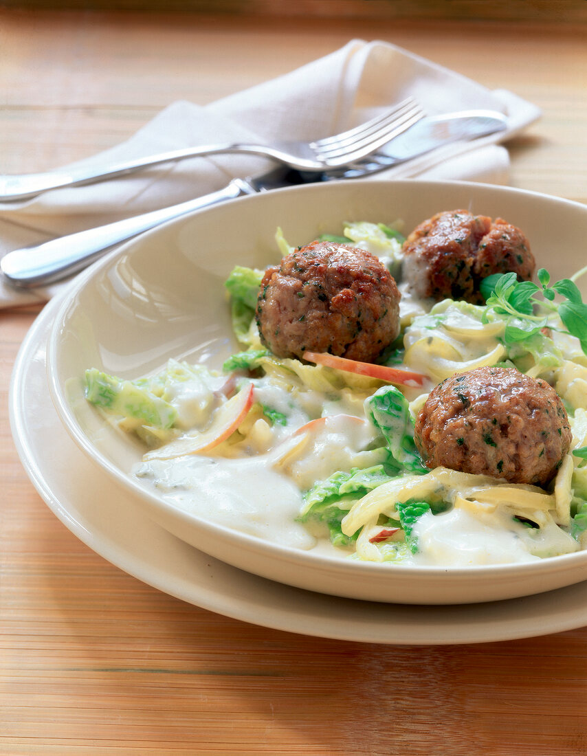 Meatballs with gorgonzola and savoy on plate