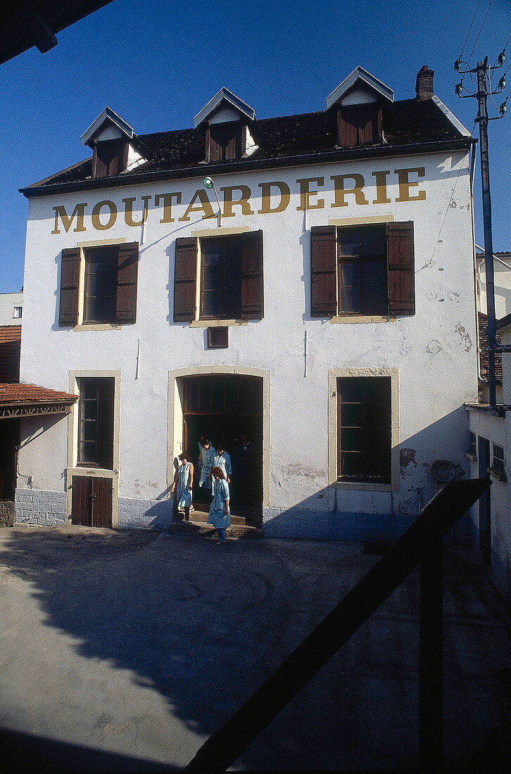 People at entrance of Moutarderie Fallot building in Beaune, France