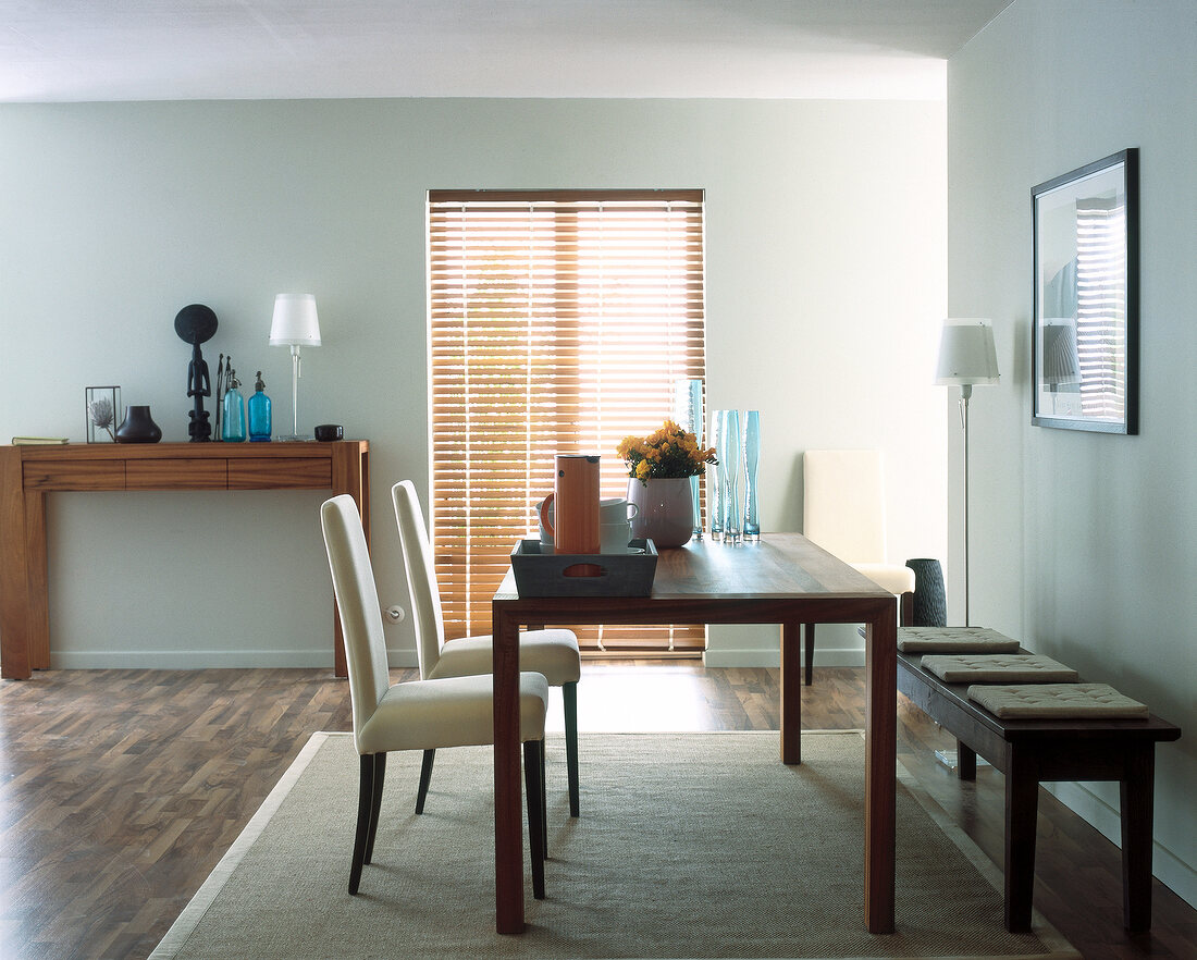 Dining room with wooden furniture, parquet flooring, sideboard and green walls