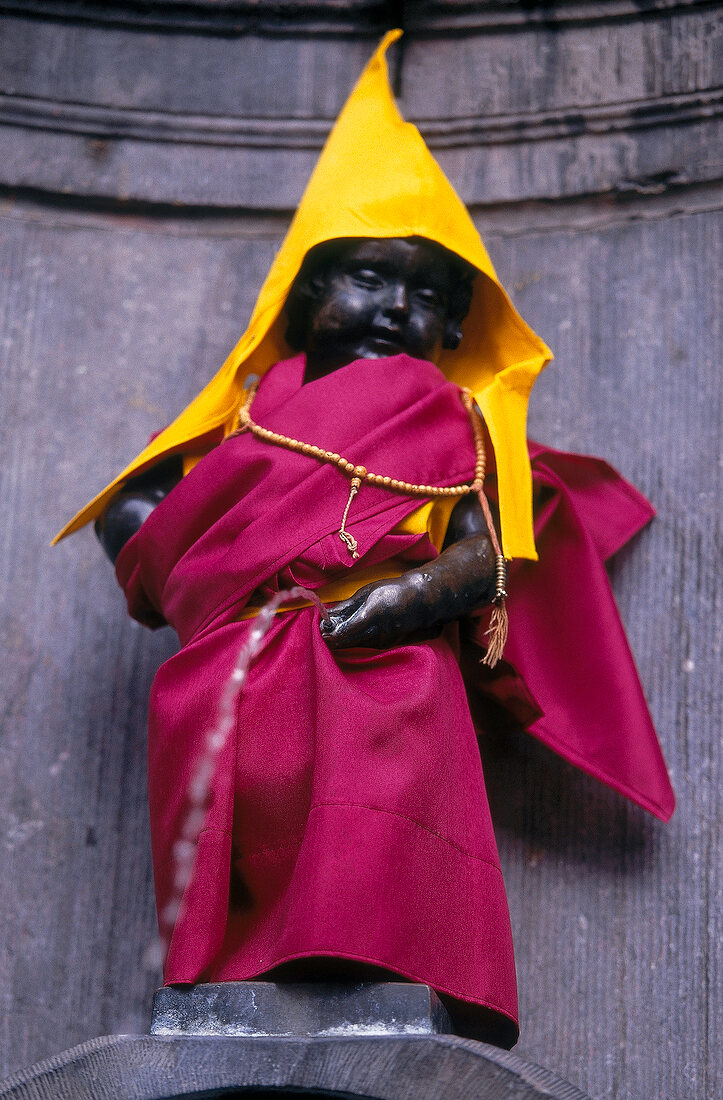 Mannequin covered in yellow and pink robe in Brussels, Belgium