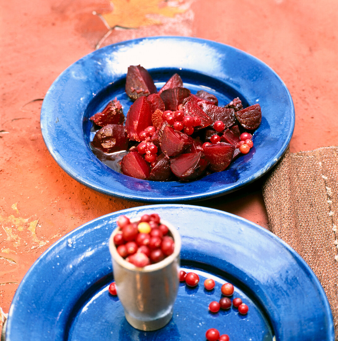Beetroot with cranberry vinaigrette on blue plate
