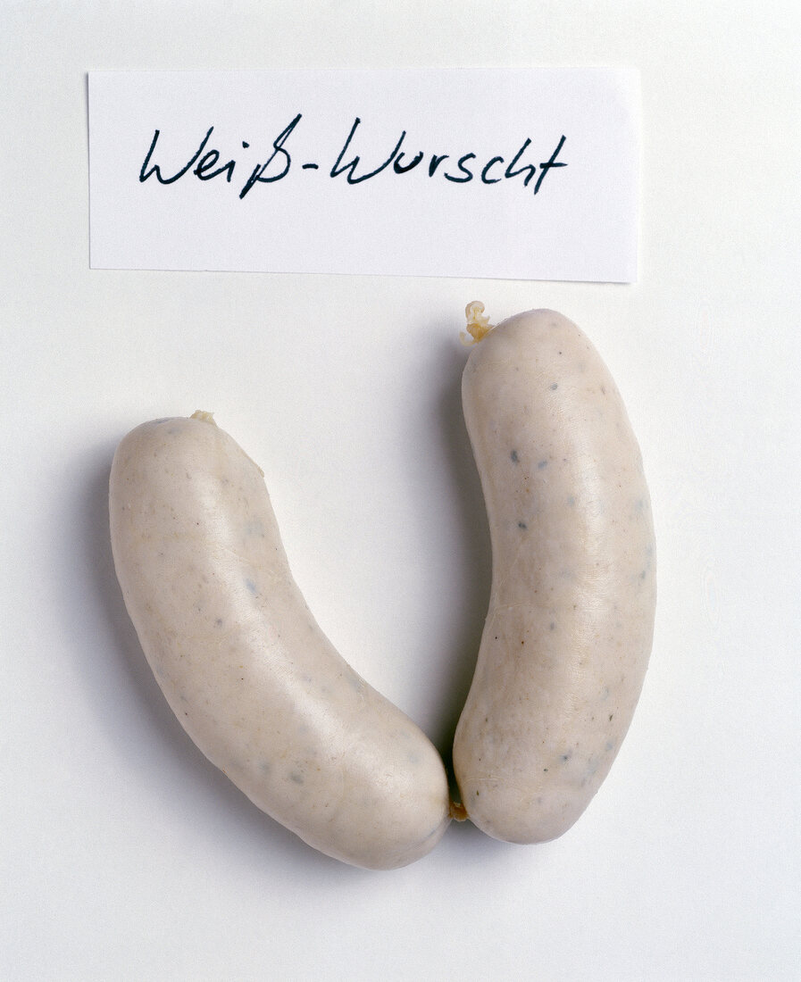 Close-up of two Bavarian white sausage on white background